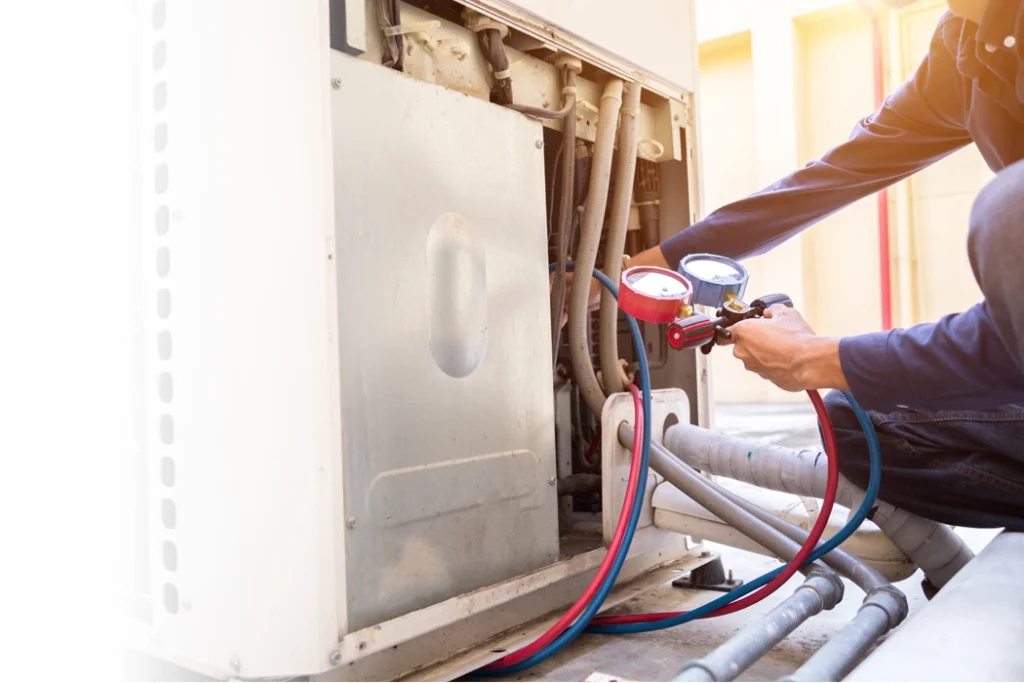 Tech repairing air conditioner